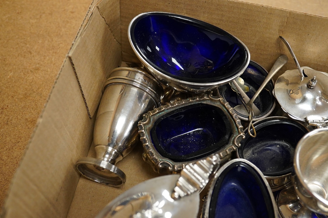 A George V pierced silver three piece condiment set, James Dixon & Sons, Sheffield, 1923/25, together with seven other assorted silver condiments, a silver mounted trinket box, a silver egg cup, a silver mounted glass sa